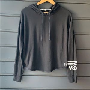 Black Victoria’s Secret hoodie with curved hem.